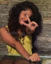 Winsome Actress Anupama Parameswaran in a Yellow Ruffled Sleeveless Top Photos 04