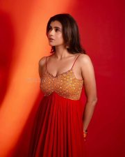 Aadya Actress Hebah Patel in a Red Anarkali Gown with an Embroidered Orange and Yellow Bodice Stills 05
