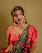 Aadya Heroine Hebah Patel in a Traditional Red and Green Half Saree with a Red Embroidered Blouse and Green Patola Dupatta Photos 04