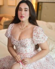 Alluring Aditi Budhathoki Cleavage in a White Floral Puff Sleeve Corset Dress Photos 02