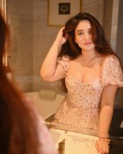 Alluring Aditi Budhathoki Cleavage in a White Floral Puff Sleeve Corset Dress Photos 04