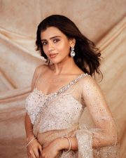 Beautiful Actress Hebah Patel in a See Through Shimmering Saree with a Sleeveless Blouse Photos 01