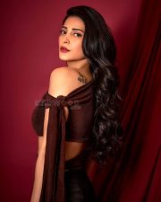 Bold Actress Shruti Haasan in a Brown Top and Floral Slit Skirt Photos 03