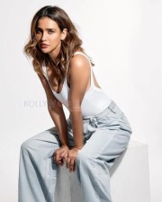 Captivating Aisha Sharma in a White Tank Top and Denim Pants Pictures 01