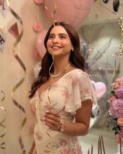 Charming Actress Aamna Sharif in a Cream Floral Dress Photos 01