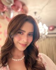 Charming Actress Aamna Sharif in a Cream Floral Dress Photos 04