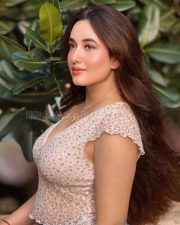 Charming Actress Aditi Budhathoki in a White Floral Lace Crop Top and Blue Jeans Photos 02