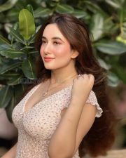 Charming Actress Aditi Budhathoki in a White Floral Lace Crop Top and Blue Jeans Photos 03