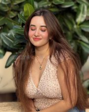 Charming Actress Aditi Budhathoki in a White Floral Lace Crop Top and Blue Jeans Photos 04