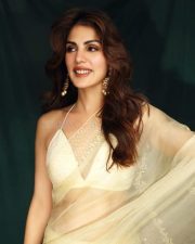 Dazzling Beauty Rhea Chakraborty in a Transparent Cream Net Saree Photos 04