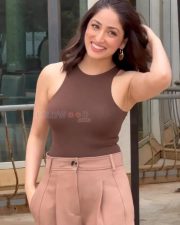 Dhoom Dhaam Actress Yami Gautam in a Brown Ribbed Tank Top with a Beige Wide Leg Trousers Photos 01