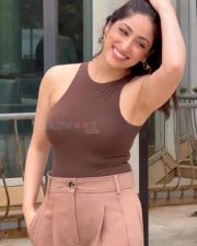 Dhoom Dhaam Actress Yami Gautam in a Brown Ribbed Tank Top with a Beige Wide Leg Trousers Photos 02