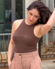 Dhoom Dhaam Actress Yami Gautam in a Brown Ribbed Tank Top with a Beige Wide Leg Trousers Photos 03