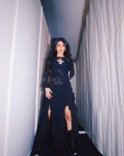 Fashionista Shruti Haasan in a Black Ruffle Maxi Dress with Thigh High Boots Photos 03