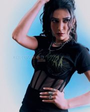 Fierce Actress Shruti Haasan in a Black gothic band graphic tee with sheer mesh corset panel midi skirt and silver spike chokers Photos 02