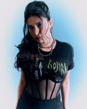 Fierce Actress Shruti Haasan in a Black gothic band graphic tee with sheer mesh corset panel midi skirt and silver spike chokers Photos 03