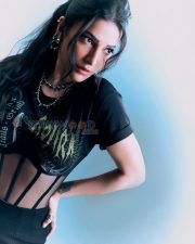 Fierce Actress Shruti Haasan in a Black gothic band graphic tee with sheer mesh corset panel midi skirt and silver spike chokers Photos 04