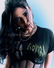 Fierce Actress Shruti Haasan in a Black gothic band graphic tee with sheer mesh corset panel midi skirt and silver spike chokers Photos 05