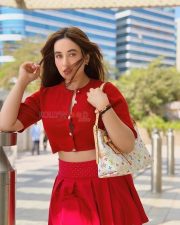Gorgeous Nepali Actress Aditi Budhathoki in a Red Button Up Crop Top with a Pleated Red Mini Skirt Pictures 02