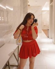 Gorgeous Nepali Actress Aditi Budhathoki in a Red Button Up Crop Top with a Pleated Red Mini Skirt Pictures 04