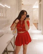 Gorgeous Nepali Actress Aditi Budhathoki in a Red Button Up Crop Top with a Pleated Red Mini Skirt Pictures 04