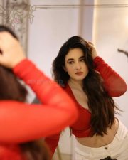 Hot Nepali Model Aditi Budhathoki in a Red Mesh Long Sleeved Crop Top with a White High Waisted Jeans Photos 01
