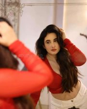 Hot Nepali Model Aditi Budhathoki in a Red Mesh Long Sleeved Crop Top with a White High Waisted Jeans Photos 01