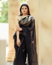 Kannai Nambathey Actress Aathmika in a Black Saree Pictures 03