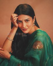 Luminous Actress Shruti Haasan in a Teal Green Embroidered Organza Saree with Gold Peacock Motif Photos 01