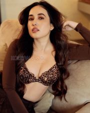 Sensual Aditi Budhathoki Cleavage in a Leopard Print Bra and Brown Wrap Photos 10