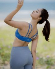So Long Valley Actress Tridha Choudhury in a Blue Sports Bra and Grey High Waisted Leggings Photos 02