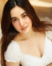 Stunning Aditi Budhathoki Cleavage in a Lace White Dress Photos 02