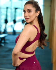 Stylish Actress Sophie Choudry in a Magenta Sports Bra and Pleated Mini Skirt Photos 01