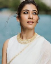 Timeless Actress Nayanthara in a White Saree with Gold Border Photos 02