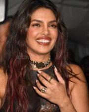 Varanasi Actress Priyanka Chopra in a Dark Brown Leather Corset Top with a Matching Brown Sarong Style Skirt Photos 01