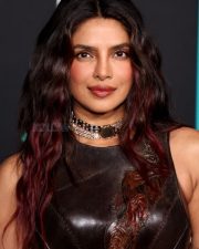 Varanasi Actress Priyanka Chopra in a Dark Brown Leather Corset Top with a Matching Brown Sarong Style Skirt Photos 02