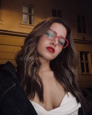 Bhooth Bangla Heroine Wamiqa Gabbi in a Strapless Silk Top with a Draped Cowl Neckline and Oversized Black Denim Jacket Photos 01