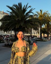 Bold Mehreen Pirzada in a Yellow and Black Halter Top and Shorts with a Loose Skirt Pictures 01