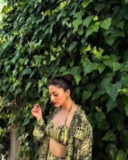 Bold Mehreen Pirzada in a Yellow and Black Halter Top and Shorts with a Loose Skirt Pictures 07