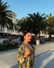 Bold Mehreen Pirzada in a Yellow and Black Halter Top and Shorts with a Loose Skirt Pictures 09