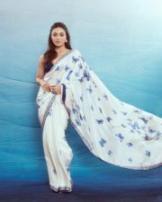 Charming Wamiqa Gabbi in a White Saree with Blue Butterfly Print and Navy Blue Blouse Photos 04