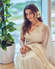 Graceful Wamiqa Gabbi in a White Chikankari Embroidered Saree Floral Border with Matching Sleeveless White Blouse 01