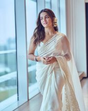 Graceful Wamiqa Gabbi in a White Chikankari Embroidered Saree Floral Border with Matching Sleeveless White Blouse 04
