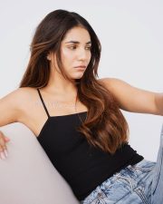 Innocent Beauty Radhika Seth in a Black Spaghetti Top and Blue Jeans Photos 02