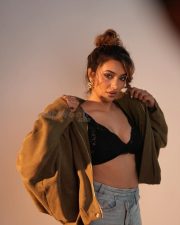 Reality Ranis of the Jungle Tejaswi Madivada in a Black Lace Triangle Bralette and High Waisted Denim Shorts Photos 01