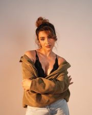 Reality Ranis of the Jungle Tejaswi Madivada in a Black Lace Triangle Bralette and High Waisted Denim Shorts Photos 02