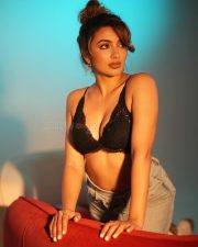 Reality Ranis of the Jungle Tejaswi Madivada in a Black Lace Triangle Bralette and High Waisted Denim Shorts Photos 03
