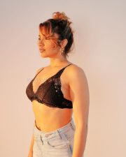 Reality Ranis of the Jungle Tejaswi Madivada in a Black Lace Triangle Bralette and High Waisted Denim Shorts Photos 04