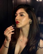 Sexy Mehreen Pirzada in a Black Cleavage Dress and Red Lipstick Photos 04