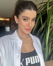 Sexy Shanaya Kapoor Drinking in a White Shirt and Puma Top Photos 01